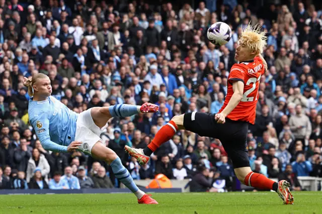 Erling Haaland's attempt on goal hits Daiki Hashioka's head