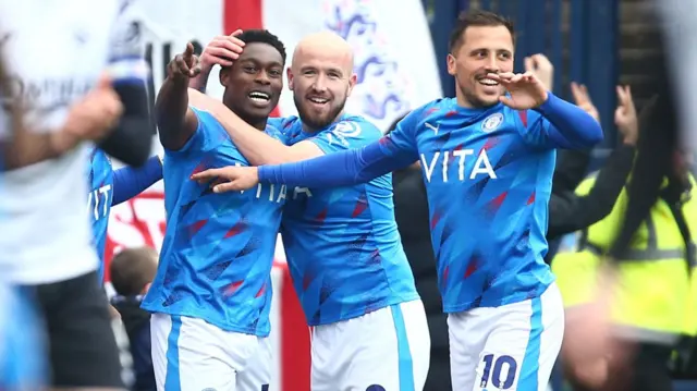 Isaac Olaofe of Stockport County celebrates