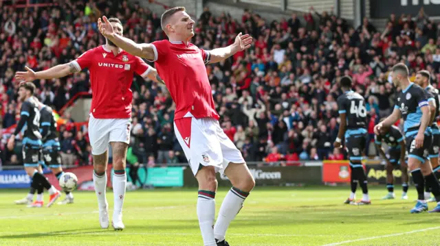 Paul Mullin of Wrexham celebrates scoring to make it 2-0