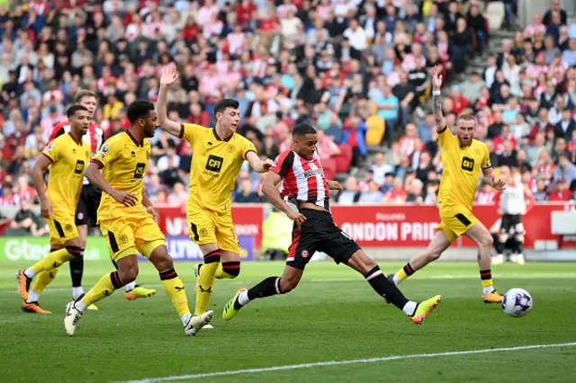 Mathias Zanka Jorgensen of Brentford shoots but is ruled out