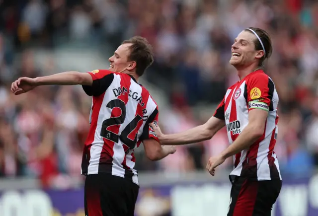 Brentford's Mikkel Damsgaard celebrates scoring a disallowed goal with Mathias Jensen