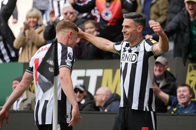 Fabian Schar (R) celebrates with Newcastle United's English midfielder #15 Harvey Barnes