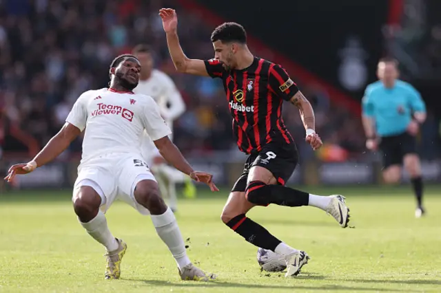 Willy Kambwala attempts to stop Dominic Solanke