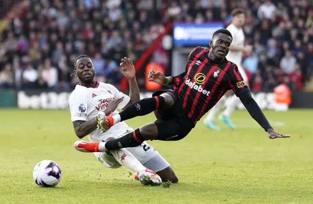 Wan-Bissaka is tackled by Outtara