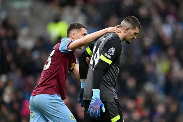 Arijanet Muric of Burnley is consoled by his teammate Maxime Esteve