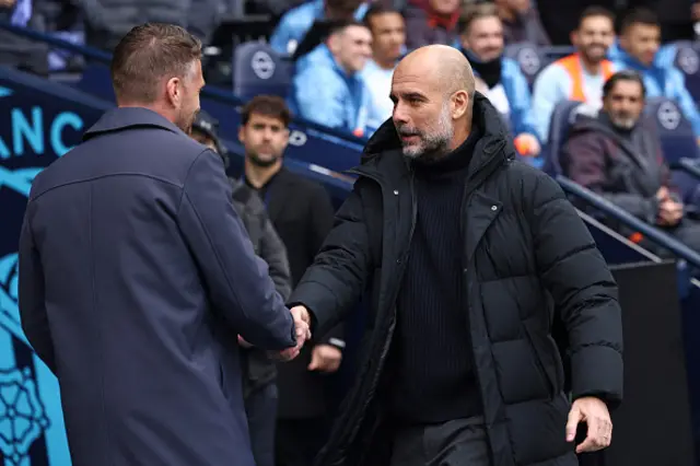 Rob Edwards and Pep Guardiola shake hands