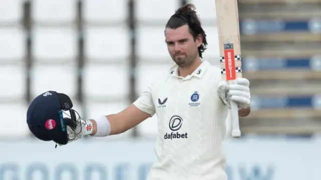 Max Holden celebrates scoring a century