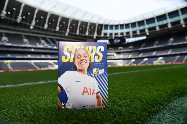 Match programme standing on the turf at Spurs stadium
