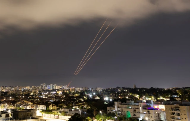 An anti-missile system operates after Iran launched drones and missiles towards Israel, as seen from Ashkelon on 13 April