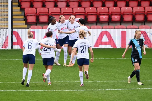 Matilda Vinberg is mobbed by teammates after scoring v Leicester