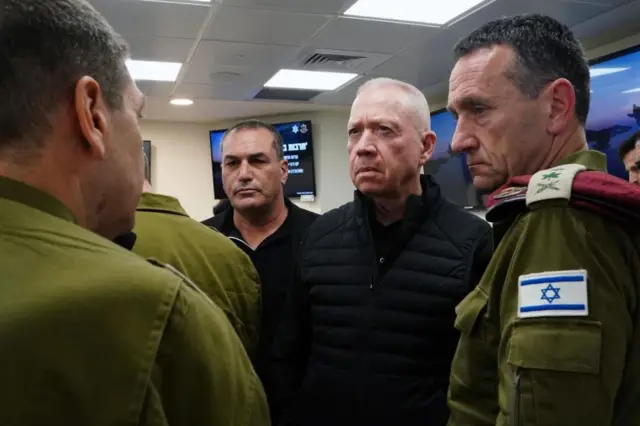 Israeli Defense Minister Yoav Gallant (2nd R) attends the Israel's war cabinet meeting on 14 Apr