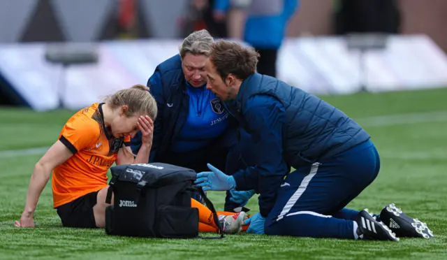 Glasgow City's Fiona Brown receives on-pitch treatment during a Scottish Women's Premier League match between Rangers and Glasgow City