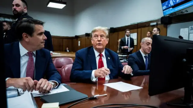 Trump sitting in the trial room