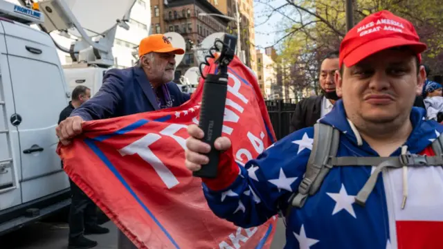 Both Trump admirers and critics have turned up at court to be part of the historic day