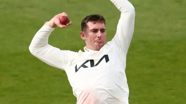 Dan Lawrence bowling for Surrey