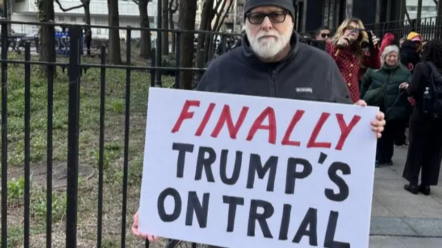 A protestor outside of the Manhattan courthouse