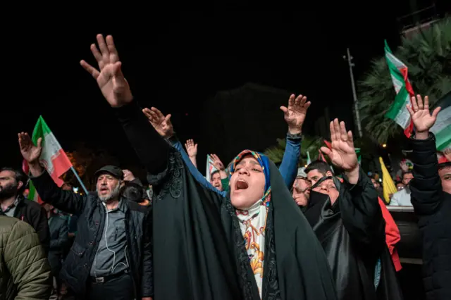 Iranian pro-government supporters shout anti-Israel slogans at Palestine Square in Tehran, on April 14, 2024, in a celebration of the early morning Iran's IRGC attack on Israel.