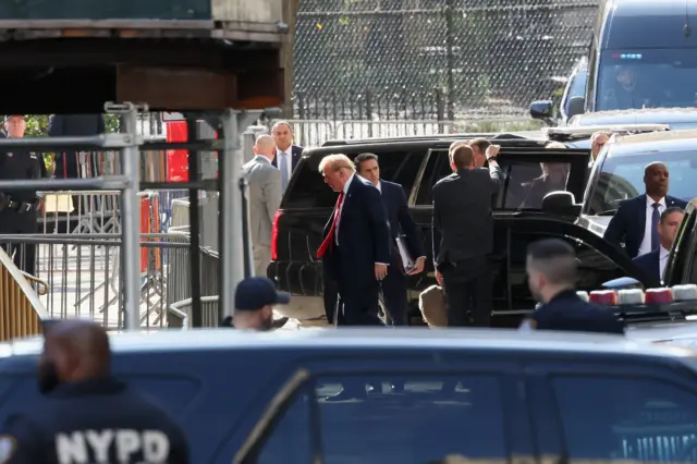 Former U.S. President Donald Trump walks on the day of his hush money criminal trial, in New York City,