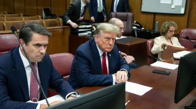 Former U.S. President Donald Trump (2nd L) sits alongside attorneys Todd Blanche (L), Emil Bove (2nd R) and Susan Necheles (R)