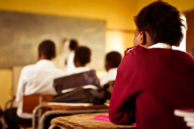 South African girl (from the Xhosa tribe) concentrates in her English class in the Transkei region of rural South Africa.