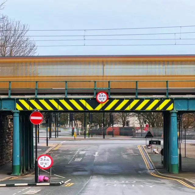 A Metro train crosses a bridge