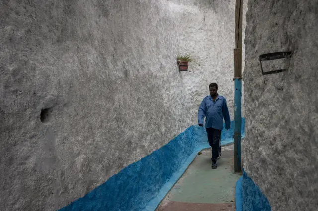 A man walking through Ethiopia's walled city of Harar.