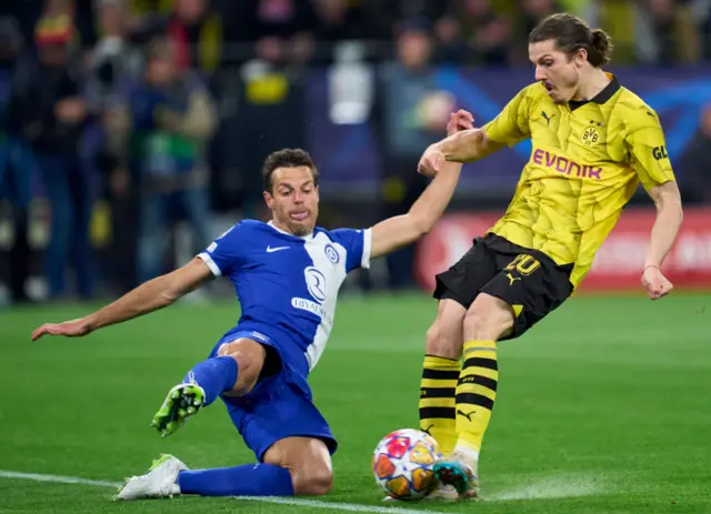 Marcel Sabitzer of Borussia Dortmund competes for the ball with Cesar Azpilicueta of Atletico Madrid