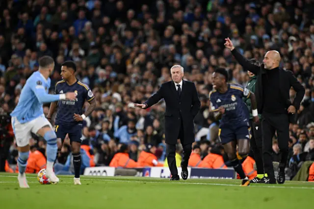 Carlo Ancelotti, Head Coach of Real Madrid, gestures alongside Pep Guardiola