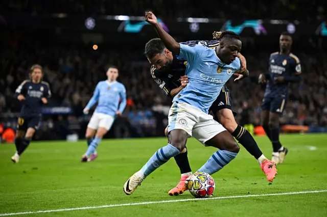 Dani Carvajal  fights for the ball with Jeremy Doku