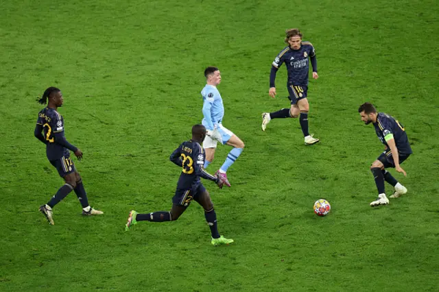 Phil Foden of Manchester City battles for possession