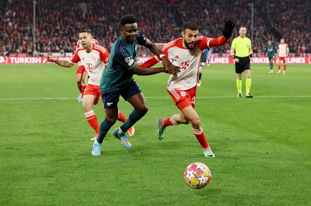 Bukayo Saka of Arsenal battles for possession with Noussair Mazraoui