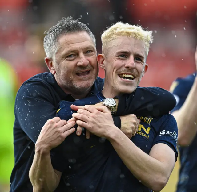 Tony Docherty and Luke McCowan celebrate Dundee clinching a top-six spot in the Scottish Premiership