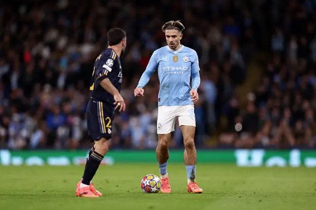 Jack Grealish of Manchester City on the ball as he prepares to take on Daniel Carvajal