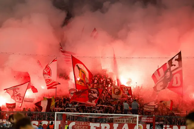 Bayern fans light flares and wave flags prior to the UEFA Champions League quarter-final