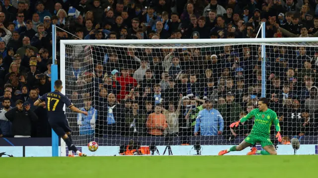 Real Madrid's Lucas Vazquez scores a penalty during a penalty shootout