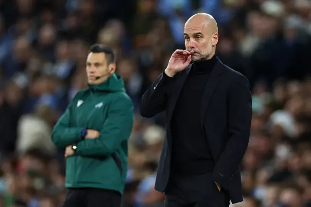 Manchester City Manager Josep Guardiola looks on