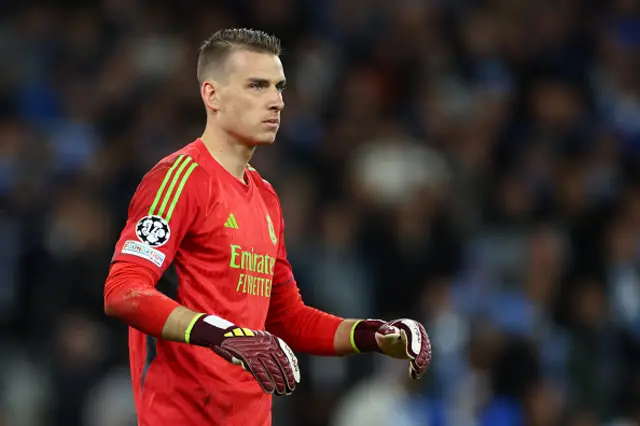 Andriy Lunin of Real Madrid looks on