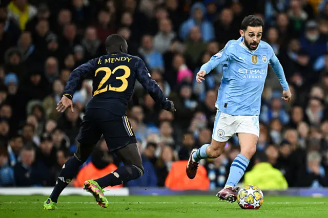 Bernardo Silva controls the ball past Real Madrid's French defender Ferland Mendy