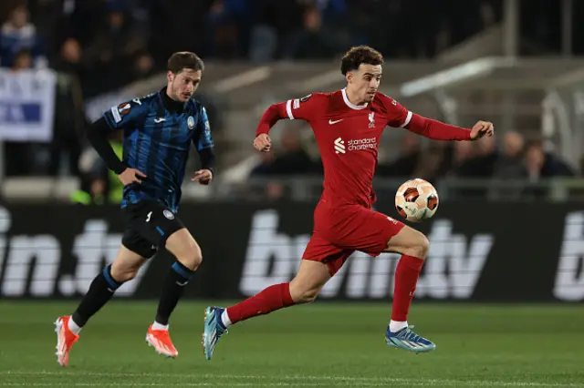 Aleksej Miranchuk of Atalanta looks on as Curtis Jones of Liverpool FC breaks with the ball