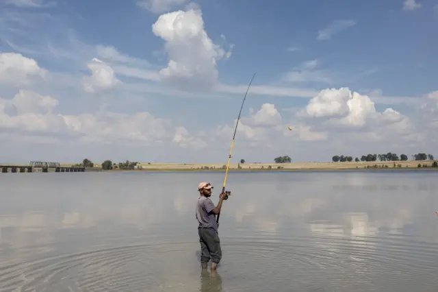 A fisherman preparing to cast off.