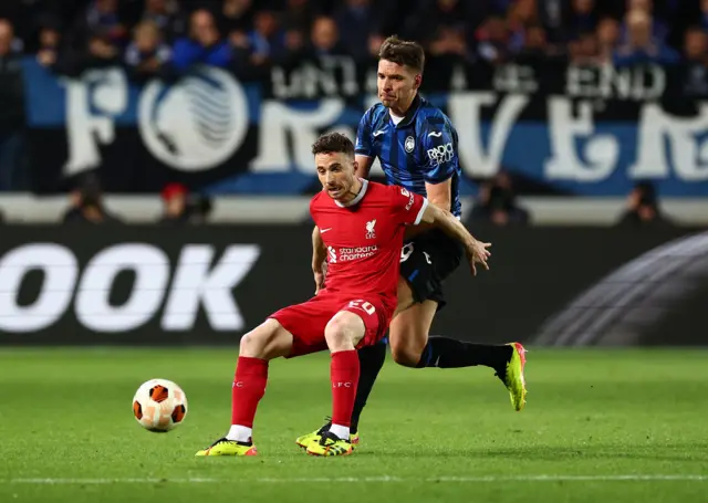 Jota attempts to control the ball