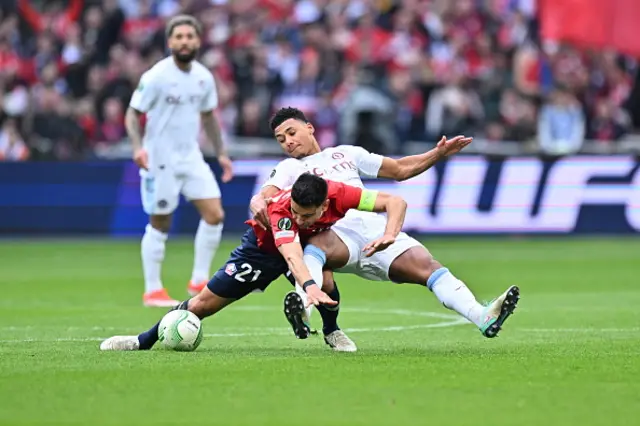 Benjamin Andre (21) of Lille in action with Ollie Watkins