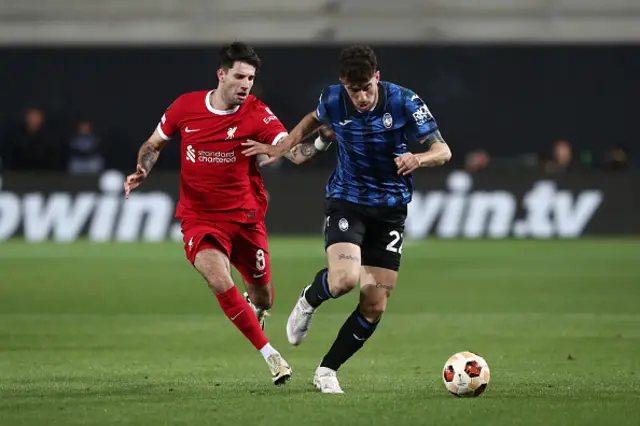 Matteo Ruggeri of Atalanta BC is challenged by Dominik Szoboszlai