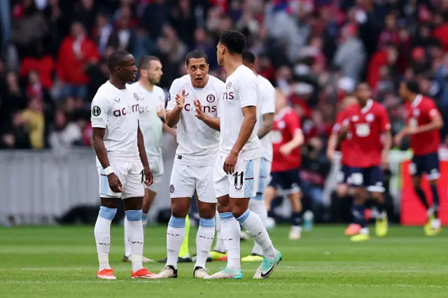 Youri Tielemans of Aston Villa speaks to team mates