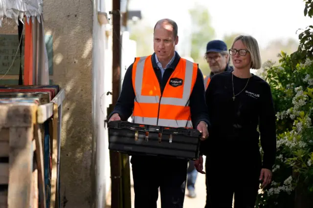 William lifting a crate