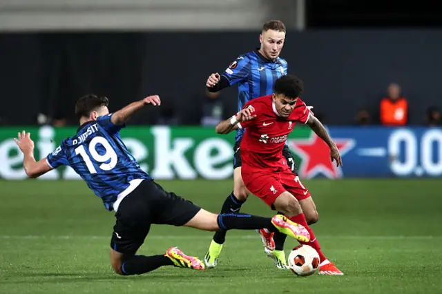 Luis Diaz of Liverpool is challenged by Berat Djimsiti