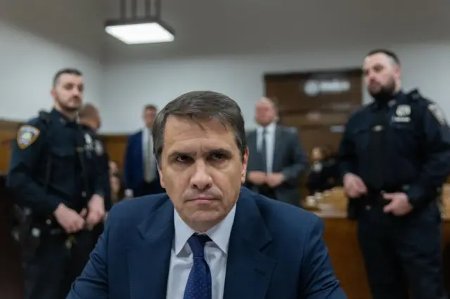 Close up of Todd Blanche looking stern in the courtroom