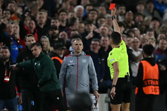 Spanish referee Jose Maria Sanchez shows a red card