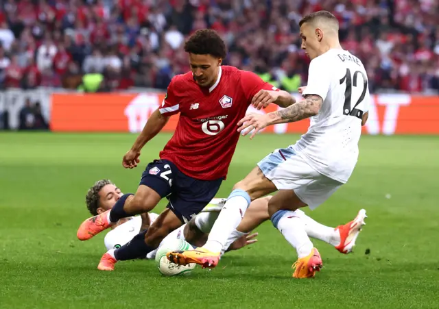 Lille's Tiago Santos in action with Aston Villa's Lucas Digne