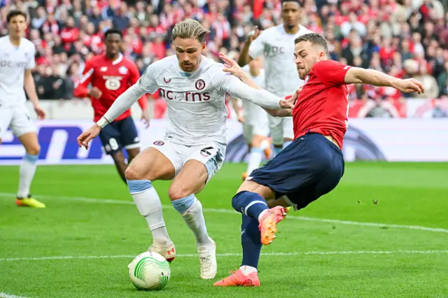 Matty Cash of Aston Villa battles for the ball with Gabriel Gudmundsson